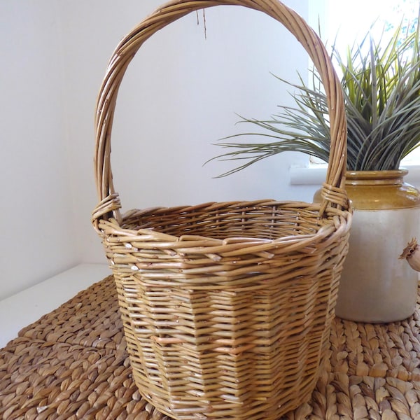 A small handmade willow basket with handle