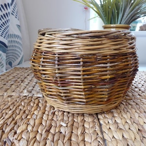 May include: A distressed wooden sign with the words "Welcome to our home" in white lettering. The sign has a rustic finish, ideal for adding a welcoming touch to a front door.