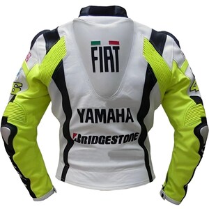May include: White and black leather motorcycle jacket with neon yellow accents. The back of the jacket features the "FIAT" logo, "YAMAHA" text, and "BRIDGESTONE" text. The jacket has padded shoulders and elbows.