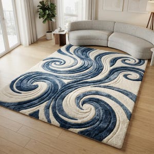 May include: A rectangular area rug featuring a high-low pile texture with a prominent swirling pattern in shades of deep navy blue and cream. The design consists of large, interconnected wave-like spirals that create a sense of movement across the surface.