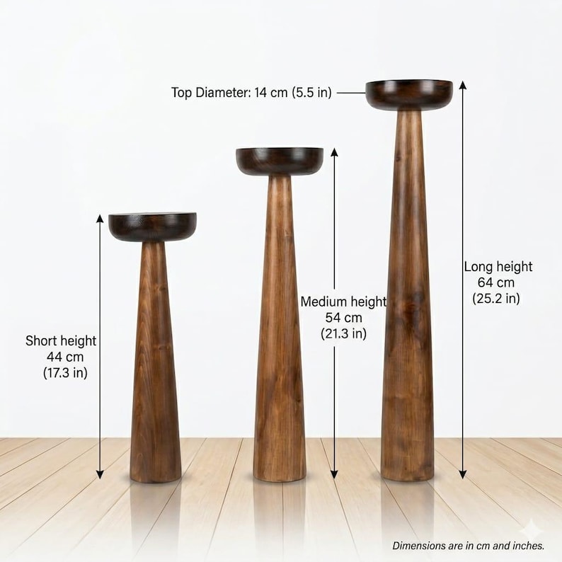 May include: Three wooden pedestal stands with varying heights. The tallest is 64 cm (25.2 in) high, the medium is 54 cm (21.3 in), and the shortest is 44 cm (17.3 in). Each stand has a dark, round top with a diameter of 14 cm (5.5 in).