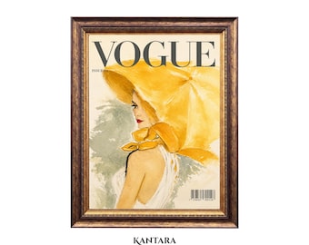 May include: A framed wall art print featuring a vintage-style magazine cover titled VOGUE ISSUE 01. The illustration depicts a person wearing a large yellow sun hat and a white garment, set against a soft green background with a barcode at the bottom.