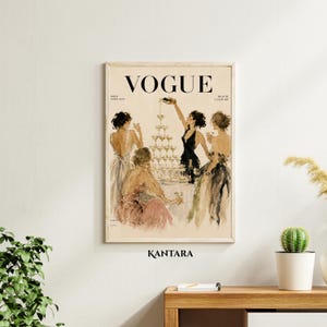 May include: A vintage-style Vogue magazine cover print featuring an illustration of four figures in evening gowns gathered around a tall champagne tower. The text VOGUE is printed in black at the top, with smaller text below. The background is cream.