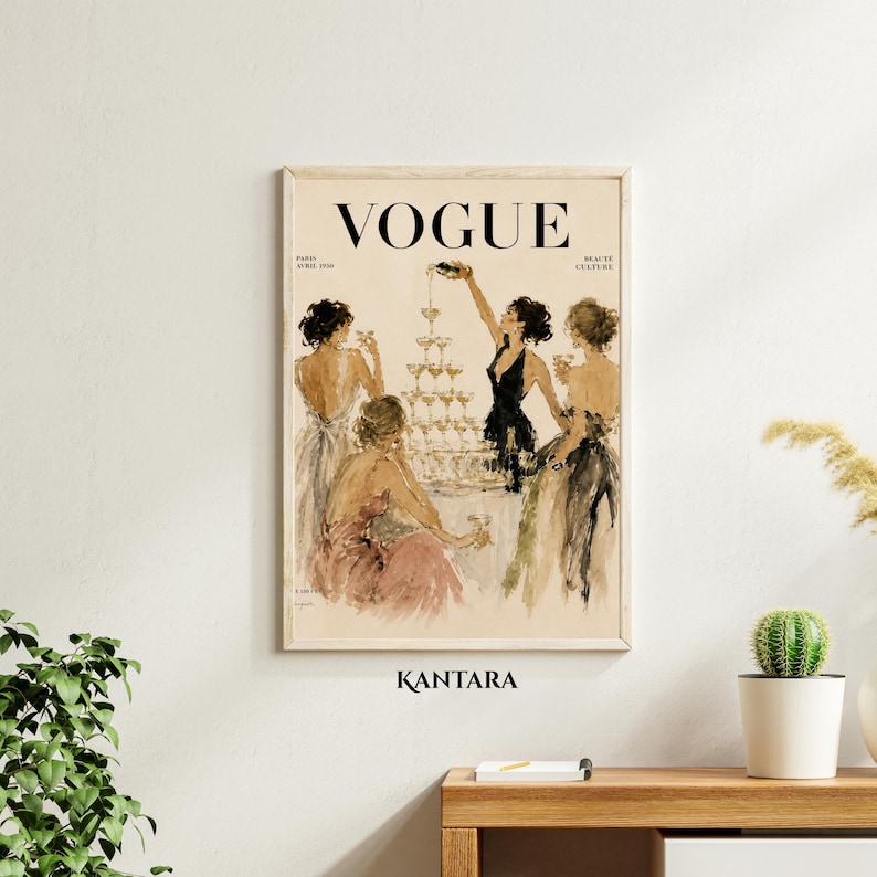 May include: A vintage-style Vogue magazine cover print featuring an illustration of four figures in evening gowns gathered around a tall champagne tower. The text VOGUE is printed in black at the top, with smaller text below. The background is cream.