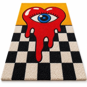 May include: A rectangular tufted rug featuring a black and white checkered pattern on the bottom half and a solid yellow background on the top half. A large red heart with a blue eye in the center is melting downward over the checkered section.