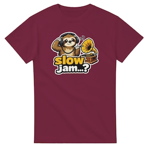 May include: A maroon t-shirt with a cartoon sloth wearing headphones and listening to a vintage gramophone. The text "slow Jam...?" is printed in a yellow and white font below the sloth and gramophone.