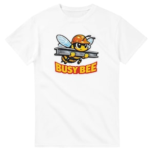 May include: White t-shirt featuring a cartoon bee wearing an orange construction hat and carrying a metal beam. The bee has black and yellow stripes and blue wings. The text "BUSY BEE" is in red and yellow.
