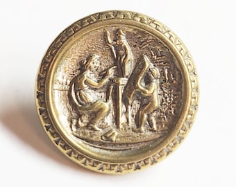 Antique Brass Picture Button ~ Woman Sculpting Minerva w/ Putto Holding Plans ~ 11/16"