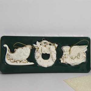 Vintage Avon White Porcelain Bisque Christmas Ornaments with 24K Gold Accents. &quot;Porcelain Ornament Trio&quot; Sleigh, a Wreath, & Angel.