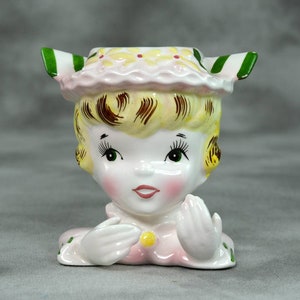 Tiny Blonde Head Vase with Daisy Bonnet and Gloved Hands. Little Head Vase with Yellow Hair and a Hat with a green and white bow.