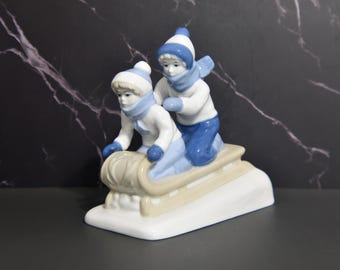 Vintage Paul Sebastian Porcelain Figurine: Children on Sled Winter Scene