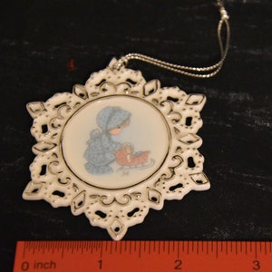 Precious Moments Dashing Through the Snow flat Ornament 1998. Porcelain Precious Moment Snowflake Ornament.