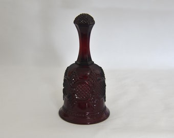 Vintage Avon Cape Cod Ruby Glass Bell. Red Dinner Bell 1876 Cape Cod Avon Pattern. Word on the Inside of the Bell: 1979 Avon Christmas.