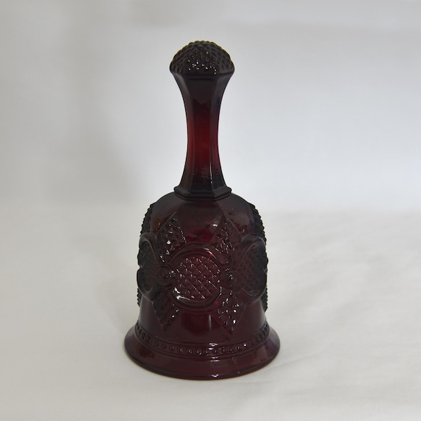 Vintage Avon Cape Cod Ruby Glass Bell. Red Dinner Bell 1876 Cape Cod Avon Pattern. Word on the Inside of the Bell: 1979 Avon Christmas.