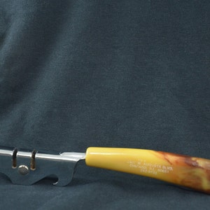 PRICE DROP. Vintage Bakelite Can Opener & Knife Sharpener - Bakelite Advertising Utensil. Butterscotch Bakelite Knife Sharpener and Opener.