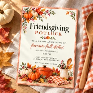 May include: A rectangular Friendsgiving Potluck invitation card featuring a red and white gingham border, decorated with watercolor pumpkins, autumn leaves, and berries. The text reads: Friendsgiving POTLUCK, JOIN US FOR AN EVENING OF favorite fall dishes, SUNDAY, NOVEMBER 22, 5:00 PM, THE HARVEST HOUSE, 27 BIRCH LANE, PORTLAND, RSVP TO KATIE 555-0166.