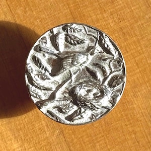 Robin's Nest button, 3/4-inch round pewter button designed and engraved by Randy Miller