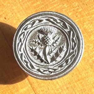 Thistle button, a large 7/8-inch round pewter button designed and engraved by Randy Miller