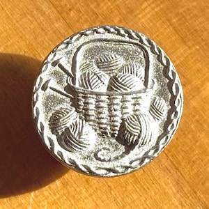 Yarn Basket button, 3/4-inch round pewter button designed and engraved by Randy Miller