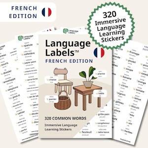 May include: A set of French language learning stickers with the text "Language Labels" and "French Edition." The stickers feature illustrations of common words, including a chair, table, and plant. A green sticker reads "320 Immersive Language Learning Stickers."
