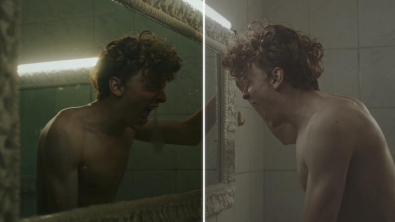 May include: A two-part image depicts a person with curly hair shouting in a bathroom. The person is shirtless and facing a mirror. The bathroom has a vintage aesthetic with a light fixture above the mirror.