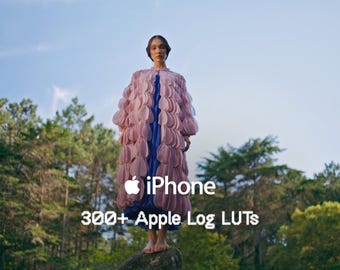 May include: A person stands on a rock in a forest, wearing a long pink and blue coat. The image includes the Apple iPhone logo and text that reads "iPhone 300+ Apple Log LUTs."