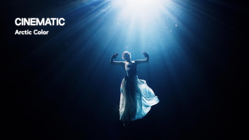 May include: A dramatic image featuring a person in a flowing white dress, arms outstretched, bathed in a bright light from above. The text "CINEMATIC Arctic Color" is visible against a dark blue backdrop.