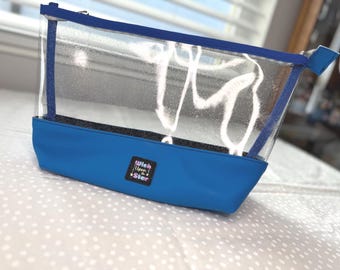 Handmade clear vinyl topped large zipper pouch with a blue faux leather base