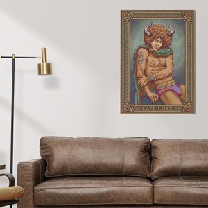 May include: A framed Capricorn zodiac art print. The artwork features a person with horns, wearing a green shawl and purple shorts. The print has a decorative border and the word "CAPRICORN" at the bottom.