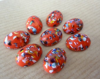 4 glass cabochons, 14x10mm, Harlequin, red, oval