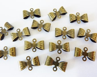 12 brass connectors, bow, bronze