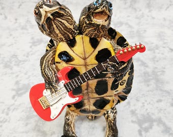 Taxidermy two-headed turtle, mariachi  guitar Jimmy Page Robert Plant