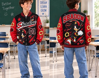May include: A black and red varsity jacket featuring a graphic of the character Shadow from the Sonic series. The front displays the text Shadow and the number 01, while the back features a large illustration of Shadow with the text Shadow.
