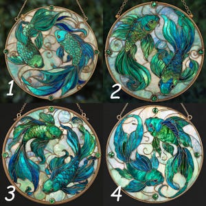 May include: Four round stained glass panels featuring koi fish in shades of teal, turquoise, and green. Each panel has a gold-colored metal frame and a chain for hanging. The fish have detailed scales and flowing fins, creating a vibrant aquatic theme.