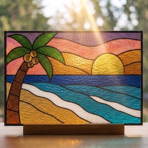 May include: Stained glass panel depicting a tropical beach scene with a palm tree, ocean waves, and a setting sun. The artwork features vibrant colors including blue, gold, green, and pink. The panel is displayed on a wooden base.