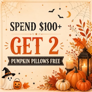 May include: A promotional graphic featuring the text SPEND $100+ GET 2 PUMPKIN PILLOWS FREE. The design includes a white ghost in a black hat, a small jack-o'-lantern, three orange and white pumpkins, two lit candles, and autumn leaves.