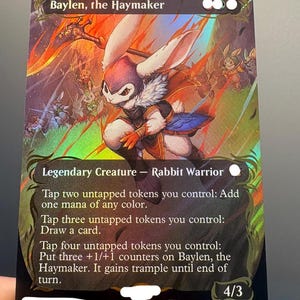 May include: A holographic Magic: The Gathering trading card titled Baylen, the Haymaker, featuring a white rabbit warrior in a purple hood and armour. The card text details abilities involving tapping tokens for mana, card draw, and +1/+1 counters.