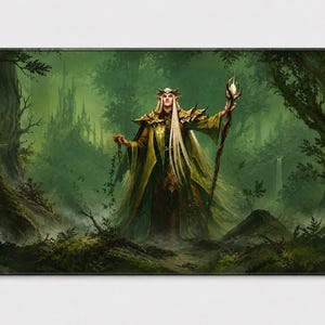 May include: A rectangular desk mat featuring a fantasy illustration of a long-haired elf figure wearing gold armour and green robes. The figure holds a glowing staff in a misty, green-toned forest setting with a distant castle structure visible.
