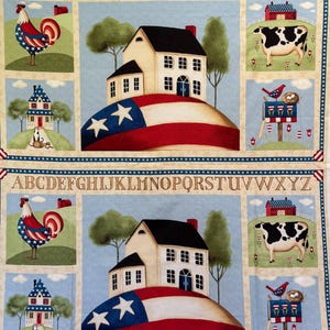 May include: Fabric panel featuring patriotic Americana imagery. The design includes a house on a hill with an American flag, a rooster, a cow, and a birdhouse. The top and bottom borders display the alphabet.