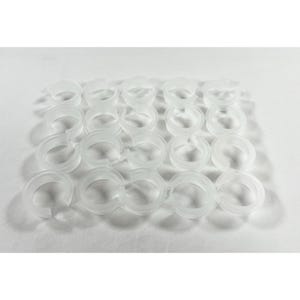 May include: A collection of twenty small, translucent white plastic rings arranged in a four-by-five grid. Each ring features a C-shaped design with a small opening on one side, constructed from a smooth, semi-transparent material.