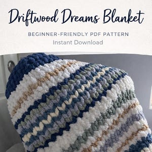 May include: A handmade, chunky knit blanket in shades of blue, white, and tan. The blanket features a textured, diagonal stripe pattern. Text on the image reads "Driftwood Dreams Blanket" and "Ready to Make, Cozy & Beautiful."