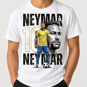 May include: A white t-shirt featuring a graphic print of Neymar Jr. in a yellow and blue soccer uniform, a large number 10, and a portrait of the athlete. The text NEYMAR JR is printed in bold black letters above and below the central figure.