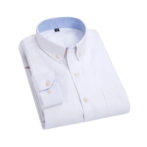 A button-down shirt with a classic collar and buttoned cuffs. The shirt features white buttons and a pocket on the left side. The collar has a striped pattern on the inside.