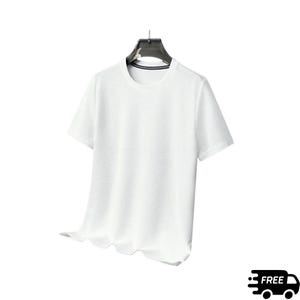 May include: A white, short-sleeved t-shirt with a textured surface, hanging on a black hanger. The shirt has a crew neck and a slightly ruffled hemline. The background is plain white.