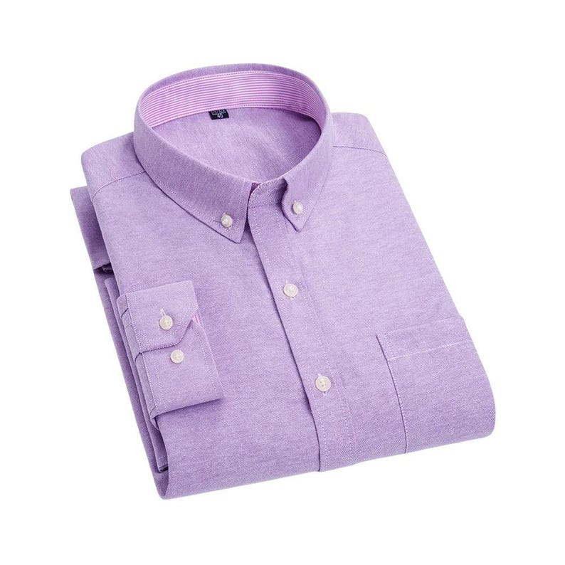 A lilac button-down shirt with a button-down collar and a chest pocket. The shirt is neatly folded, showing the buttoned cuffs and the striped lining of the collar.