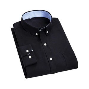 A navy blue button-down shirt with a classic collar and buttoned cuffs. The shirt features white buttons and a pocket on the left side. The collar has a striped pattern on the inside.