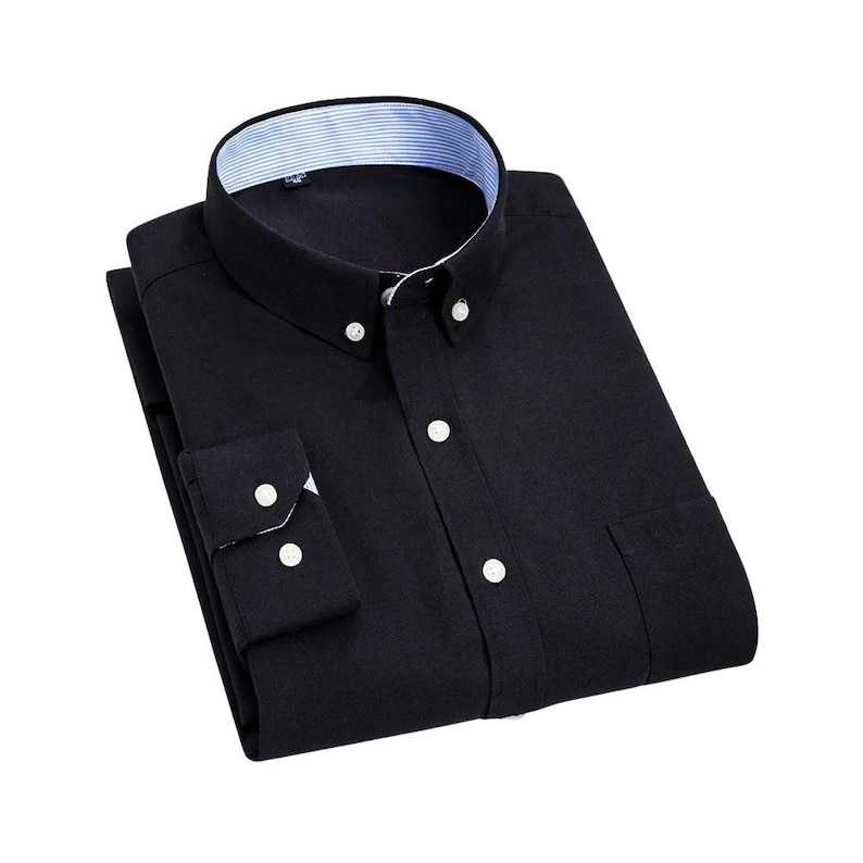 A navy blue button-down shirt with a classic collar and buttoned cuffs. The shirt features white buttons and a pocket on the left side. The collar has a striped pattern on the inside.