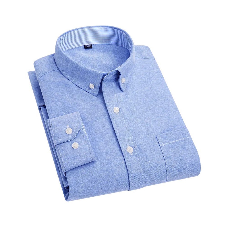A pale blue button-down shirt with a classic collar and a chest pocket. The shirt has long sleeves with buttoned cuffs and white buttons. The collar has a striped pattern. The shirt is neatly folded.