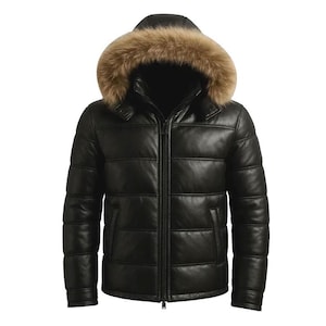 May include: Black leather puffer jacket with a fur-lined hood. The jacket features a zip-up front, side pockets, and a quilted design. The fur trim is light brown.