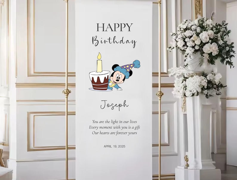 The image is a banner for a birthday celebration, featuring a cartoon character and a birthday cake. The banner has a message that reads "Happy Birthday Joseph" and includes a quote about the light in our lives.